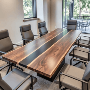 A modern conference room featuring a large wooden table with a dark stripe down the center, surrounded by eight black leather chairs. The room has natural light coming in from large windows with a view of greenery outside.
