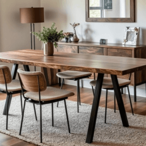 A modern dining room featuring a Black Walnut Book Matched Dining Table and four chairs on a beige rug. A sideboard adorned with decorative items stands against the wall, which features a large mirror. A potted plant and a floor lamp complete the cozy ambiance.